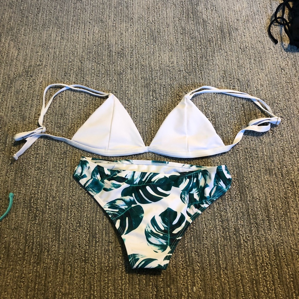 White bikini top with leaf bottoms